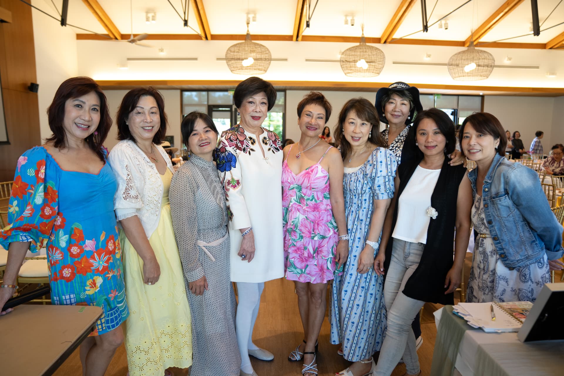 Group of guests smiling together at the God Is Good event